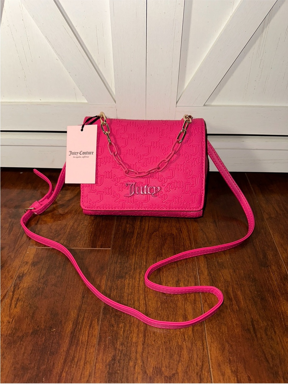 Juicy Couture Can’t Tame Her Crossbody in Pink Flash with Embossed Logo & Chain